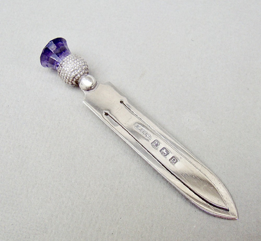 NOVELTY SILVER & AMETHYST GLASS THISTLE BOOKMARK BY ADIE & LOVEKIN, BIRMINGHAM 1913