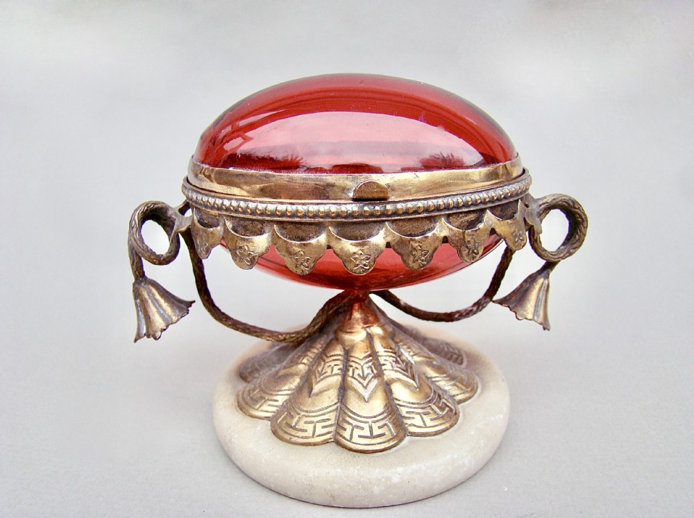 FRENCH PALAIS ROYAL EGG-SHAPED RUBY GLASS CASKET WITH GILT ORMULU MOUNTS, CIRCA 1860
