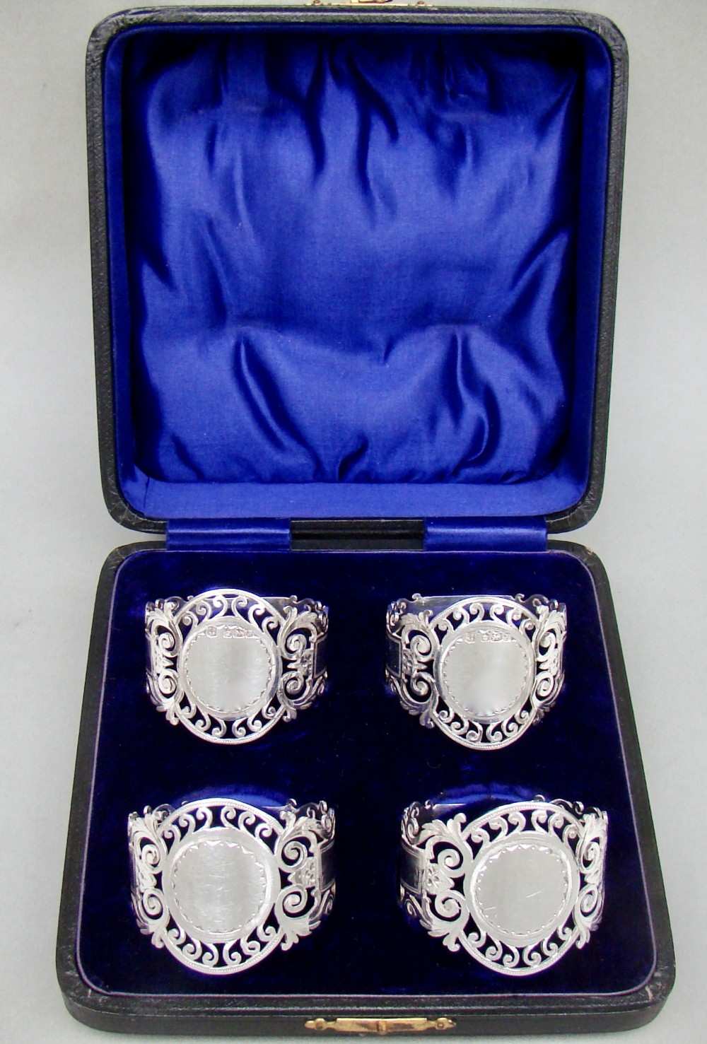 CASED SET OF FOUR EDWARDIAN SOLID SILVER NAPKIN RINGS BY COOPER BROTHERS, SHEFFIELD 1907