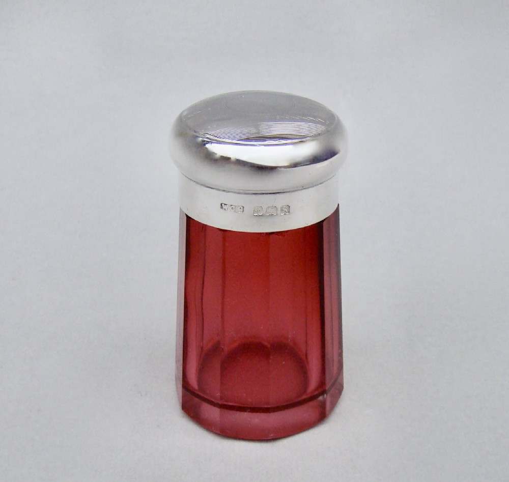 SMALL SILVER LIDDED CRANBERRY GLASS DRESSING TABLE JAR BY W.C. GRIFFITHS, BIRMINGHAM 1917
