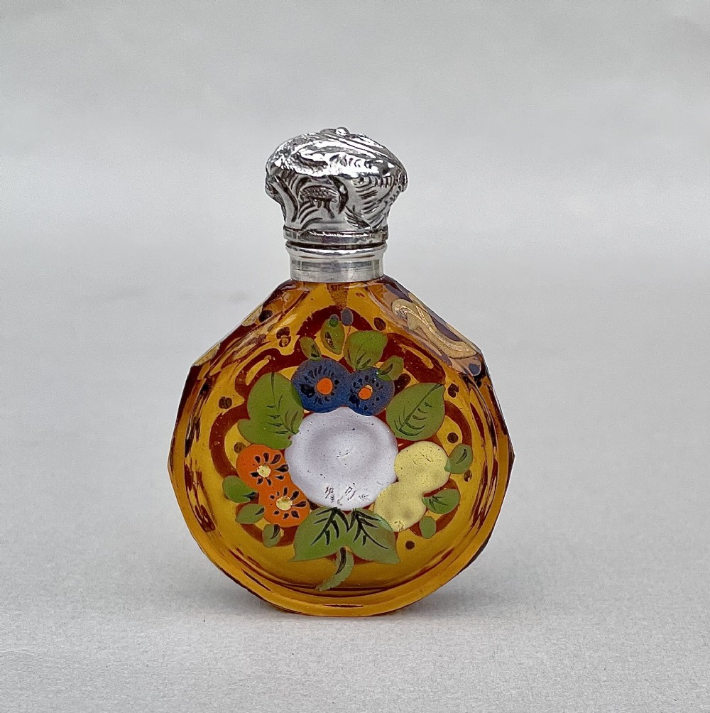 CHARMING VICTORIAN SILVER AND ENAMELLED AMBER GLASS SCENT BOTTLE, CIRCA 1890
