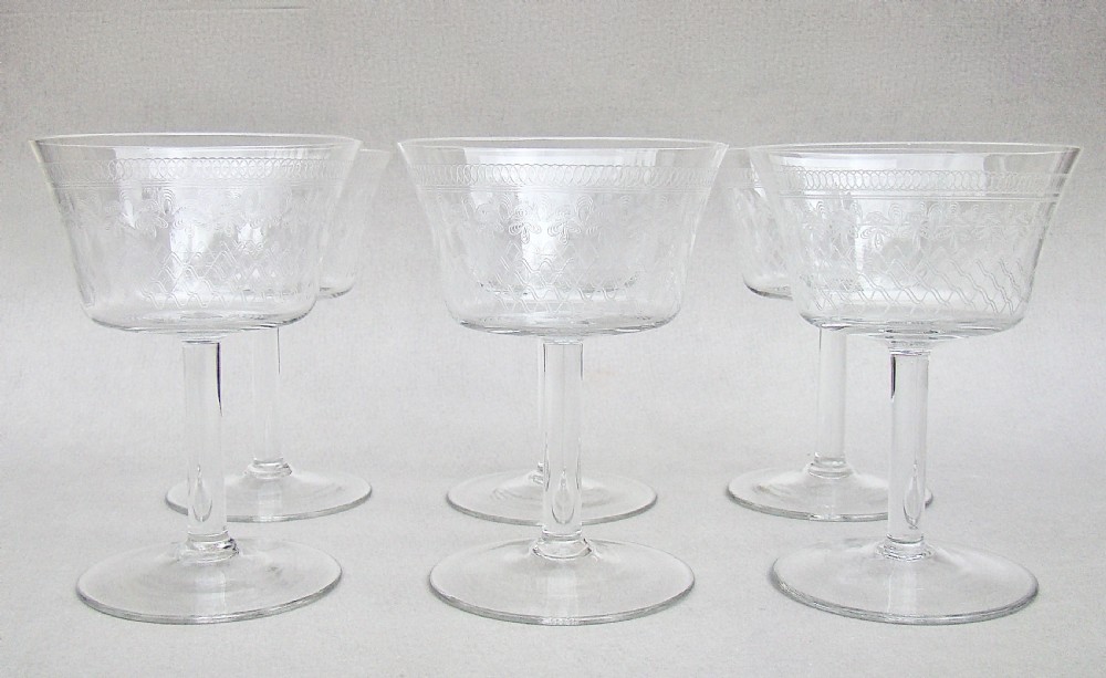 SET OF SIX ART DECO ETCHED PALL MALL CHAMPAGNE GLASSES, CIRCA 1910