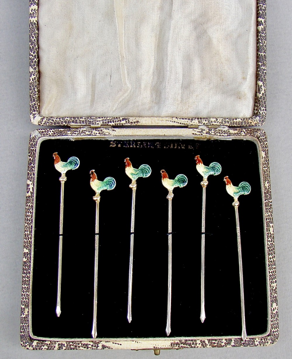 MID-CENTURY CASED SET OF SIX STERLING SILVER ENAMELLED COCKEREL COCKTAIL STICKS, CIRCA 1950