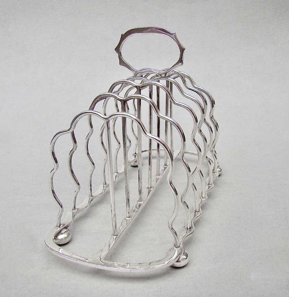 GOOD EDWARDIAN SOLID SILVER TOAST RACK BY S. GARRARD, LONDON 1905