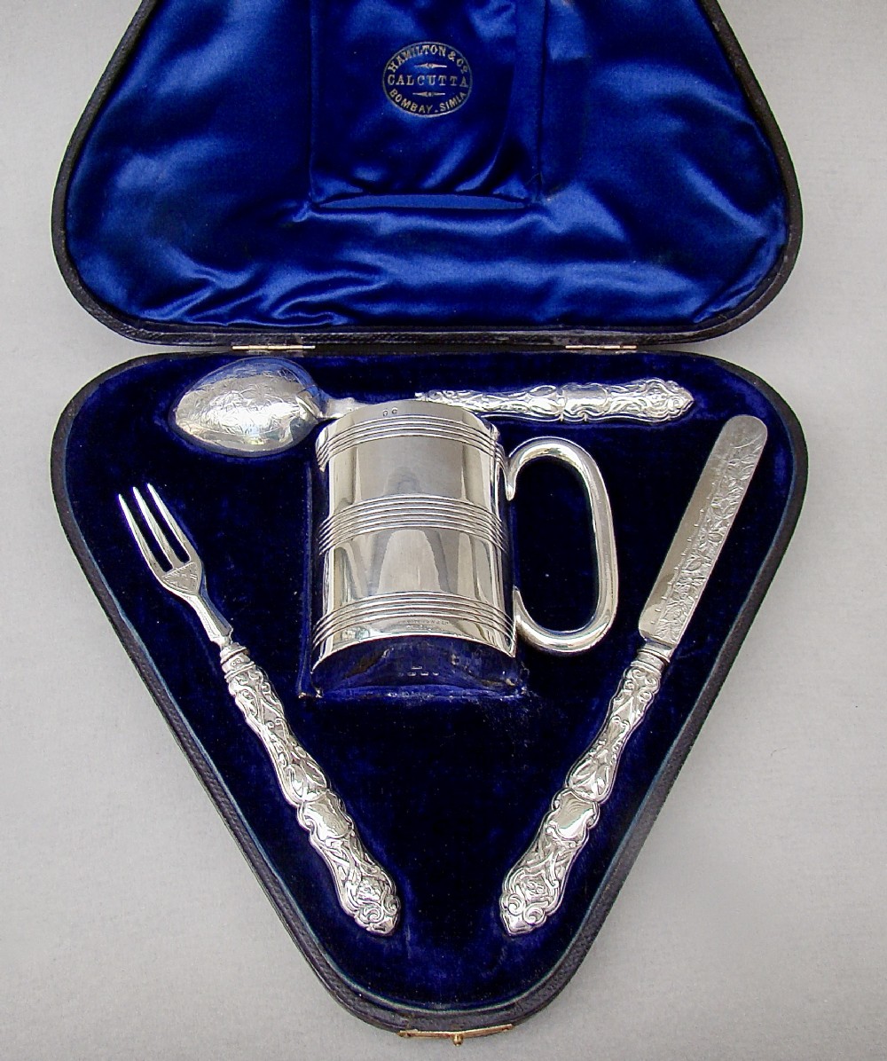 FABULOUS VICTORIAN 4-PIECE CHRISTENING SET BY COLEN HEWER CHESHIRE, BIRMINGHAM 1883, RETAILED BY HAMILTON & CO, CALCUTTA