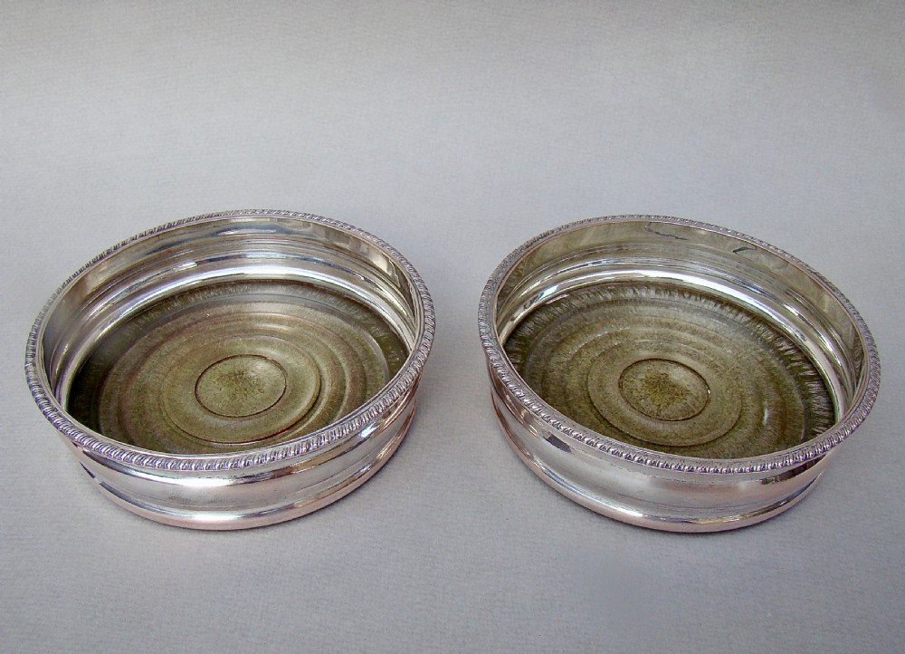 PAIR OF TURN OF THE CENTURY SILVER PLATED WINE COASTERS, CIRCA 1910 View III