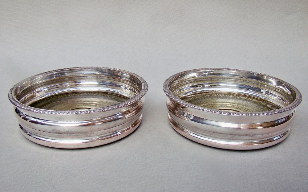 PAIR OF TURN OF THE CENTURY SILVER PLATED WINE COASTERS, CIRCA 1910 View II