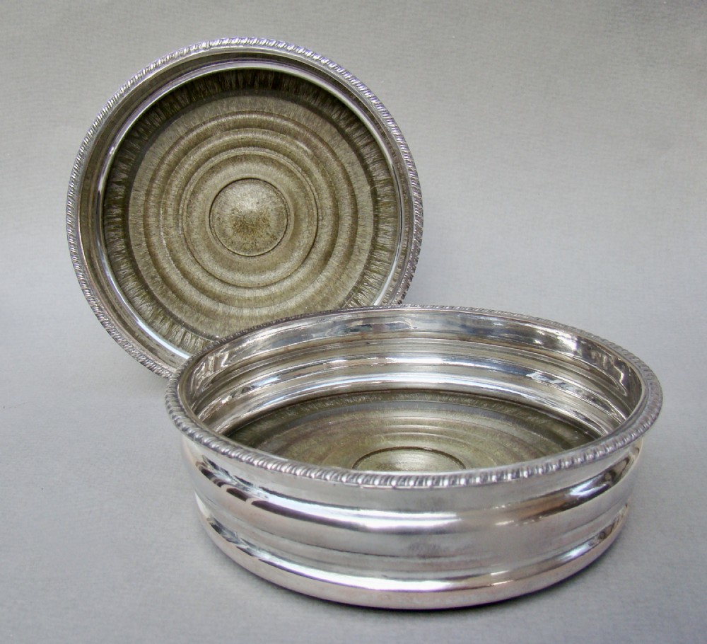 PAIR OF TURN OF THE CENTURY SILVER PLATED WINE COASTERS, CIRCA 1910