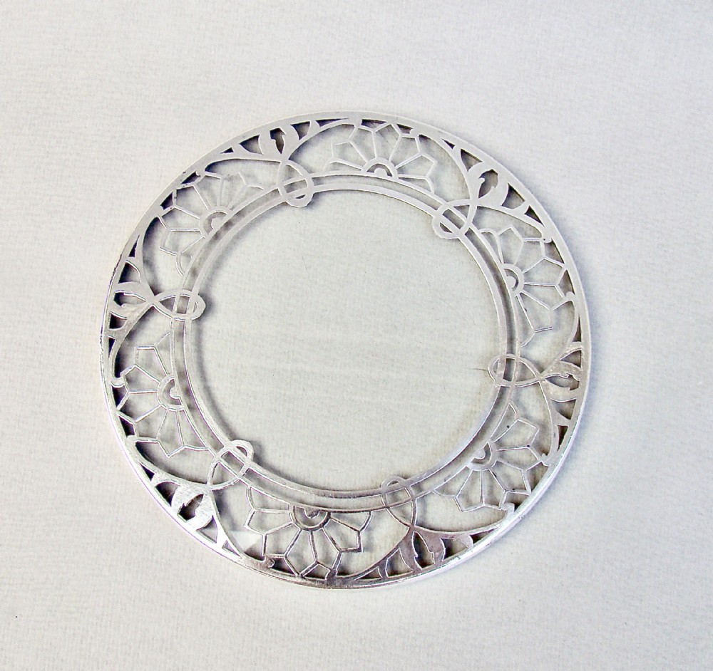UNUSUAL SILVER MOUNTED GLASS TEAPOT STAND, CIRCA 1930