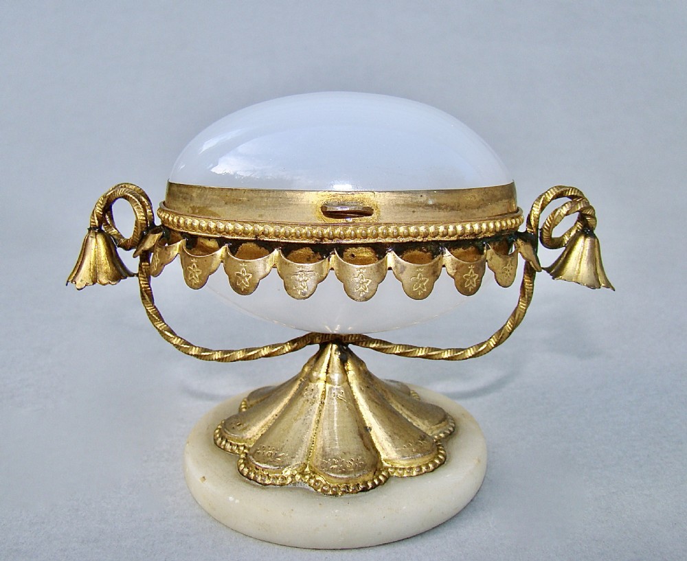 FRENCH PALAIS ROYAL EGG-SHAPED OPALINE GLASS CASKET WITH GILT ORMULU MOUNTS, CIRCA 1860