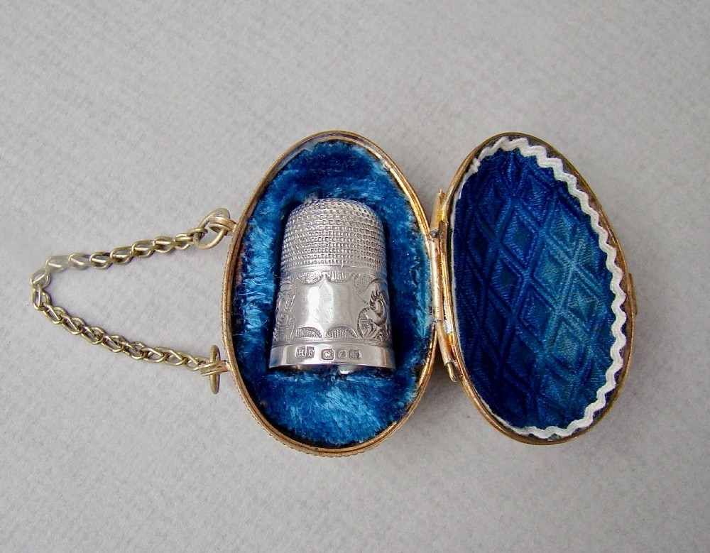 EXQUISITE VICTORIAN SOLID SILVER THIMBLE CASED IN ORMULU CHATELAINE EGG-SHAPED HOLDER
