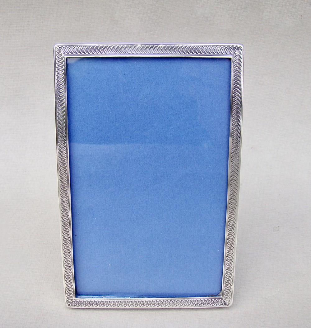 ENGINE-TURNED SILVER PHOTO FRAME BY WILLIAM HASELER, BIRMINGHAM, 1918