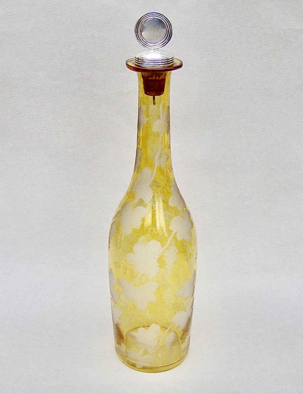 UNUSUAL SILVER MOUNTED ETCHED AMBER GLASS DECANTER BY JAMES COLLINS, LONDON 1892