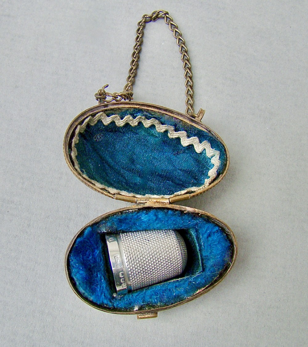 EXQUISITE VICTORIAN SOLID SILVER THIMBLE CASED IN ORMULU CHATELAINE EGG-SHAPED HOLDER
