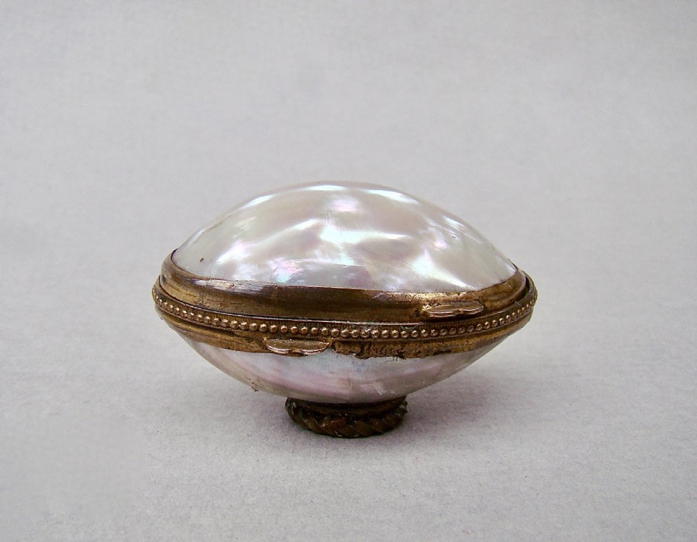 RARE 19TH C. MINIATURE SILVER THIMBLE FOR A CHILD IN MOTHER OF PEARL EGG-SHAPED CASE. View IV
