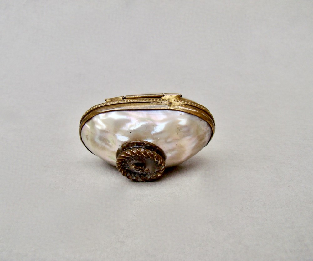 RARE 19TH C. MINIATURE SILVER THIMBLE FOR A CHILD IN MOTHER OF PEARL EGG-SHAPED CASE. View VII