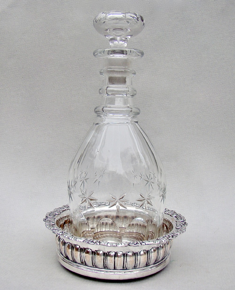 REGENCY CUT GLASS DECANTER WITH OLD SHEFFIELD PLATE COASTER, CIRCA 1825