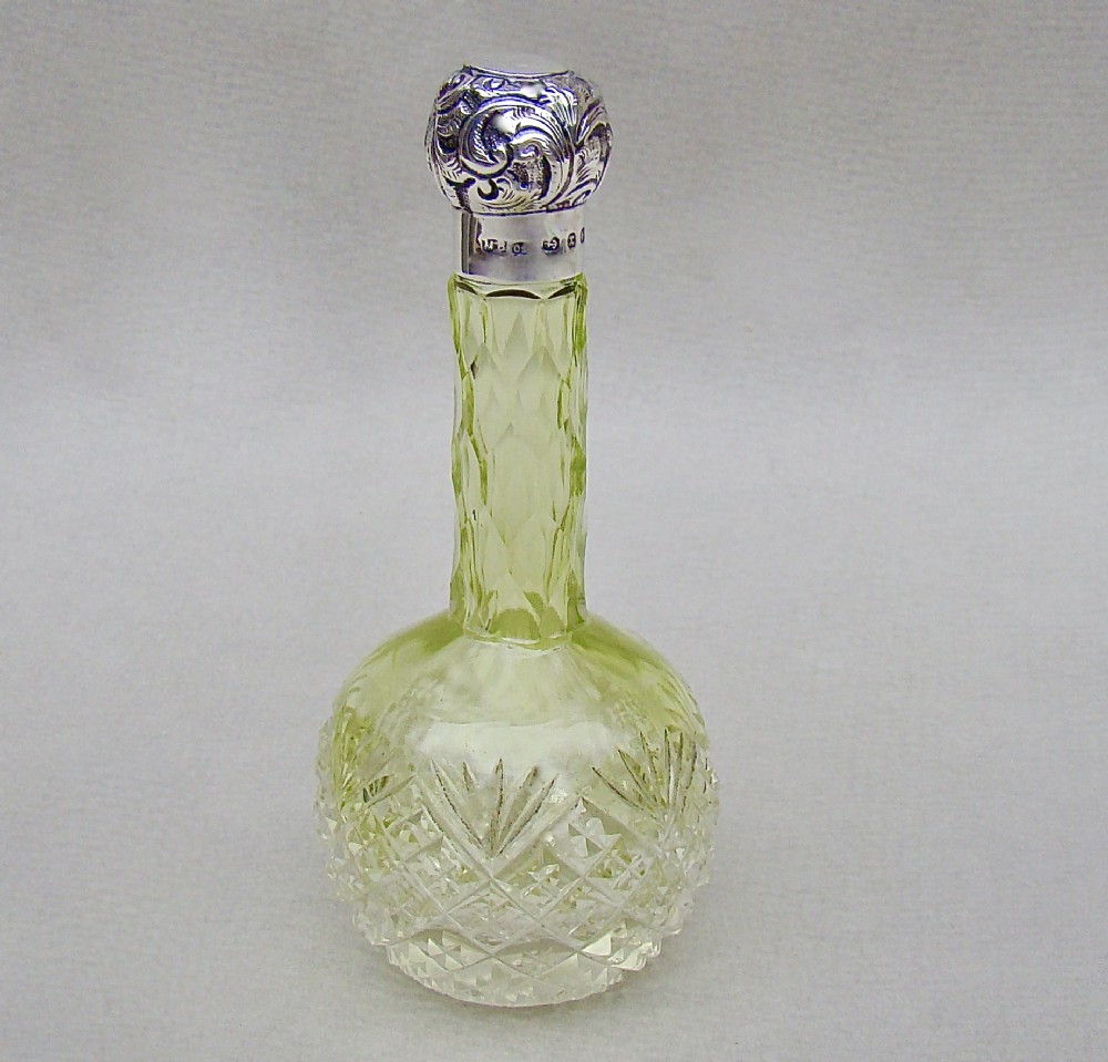 VICTORIAN SILVER MOUNTED LIME GREEN CUT GLASS SCENT BOTTLE BY THE MOUSLEY BROTHERS, BIRMINGHAM 1898