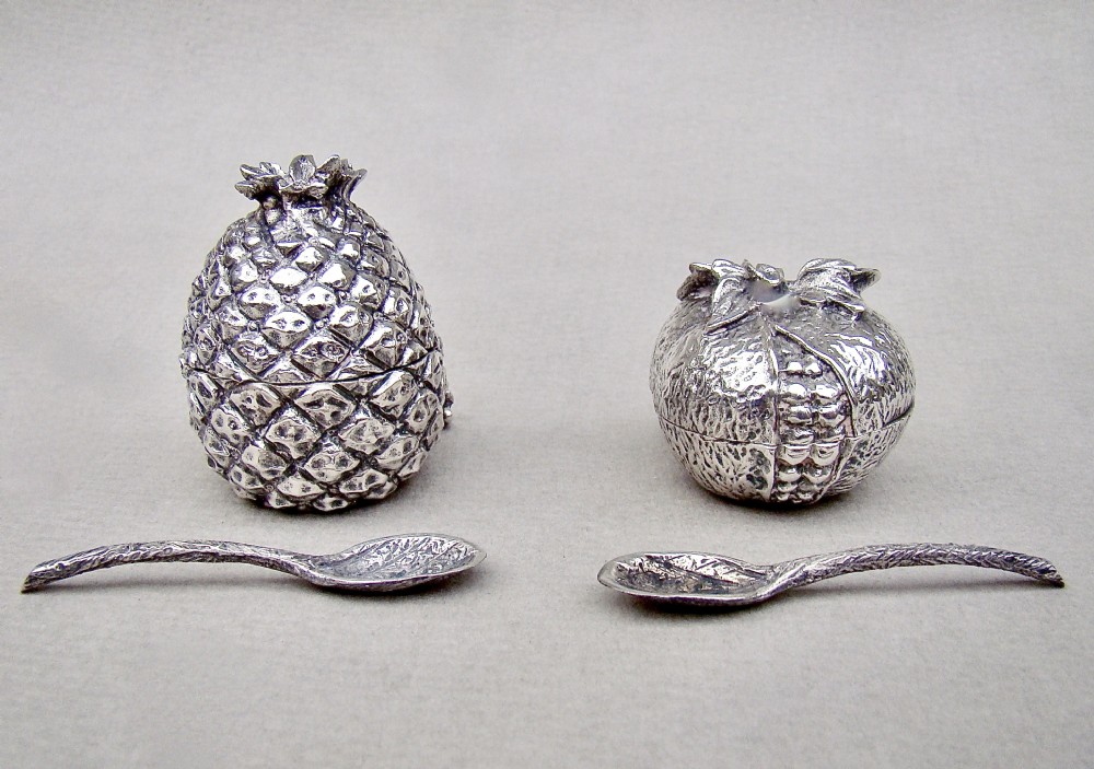NOVELTY MID-CENTURY CONTINENTAL SILVER CONDIMENT SET. MODELLED IN THE FORM OF A PINEAPPLE AND POMEGRANATE