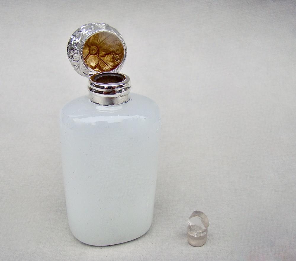A Victorian white opaline glass scent bottle with a cylindrical body and an embossed silver top. View V