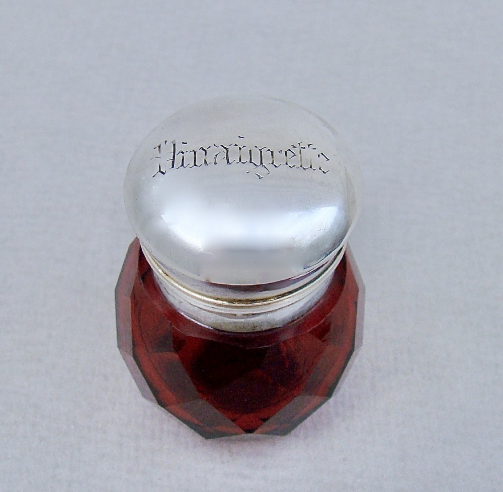 UNUSUAL VICTORIAN SILVER SLICED-CUT RUBY GLASS VINAIGRETTE , CIRCA 1890
