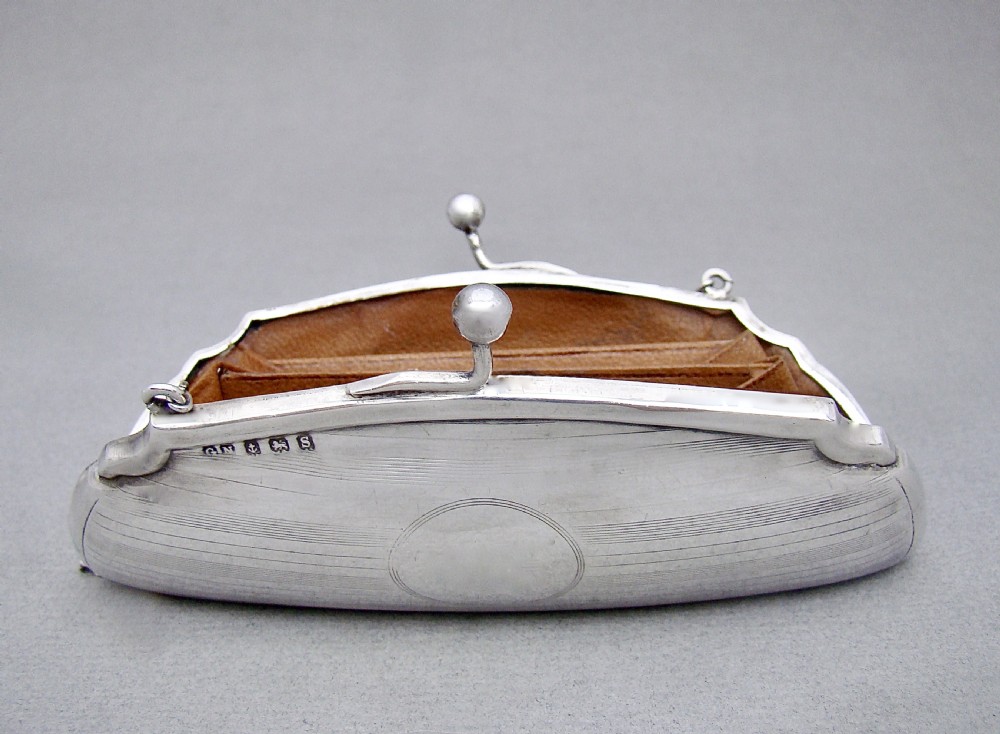 A George V sterling silver cocktail purse with engine-turned linear decoration, a central circular cartouche, a ball clasp, and a fine silver chain handle. View IV