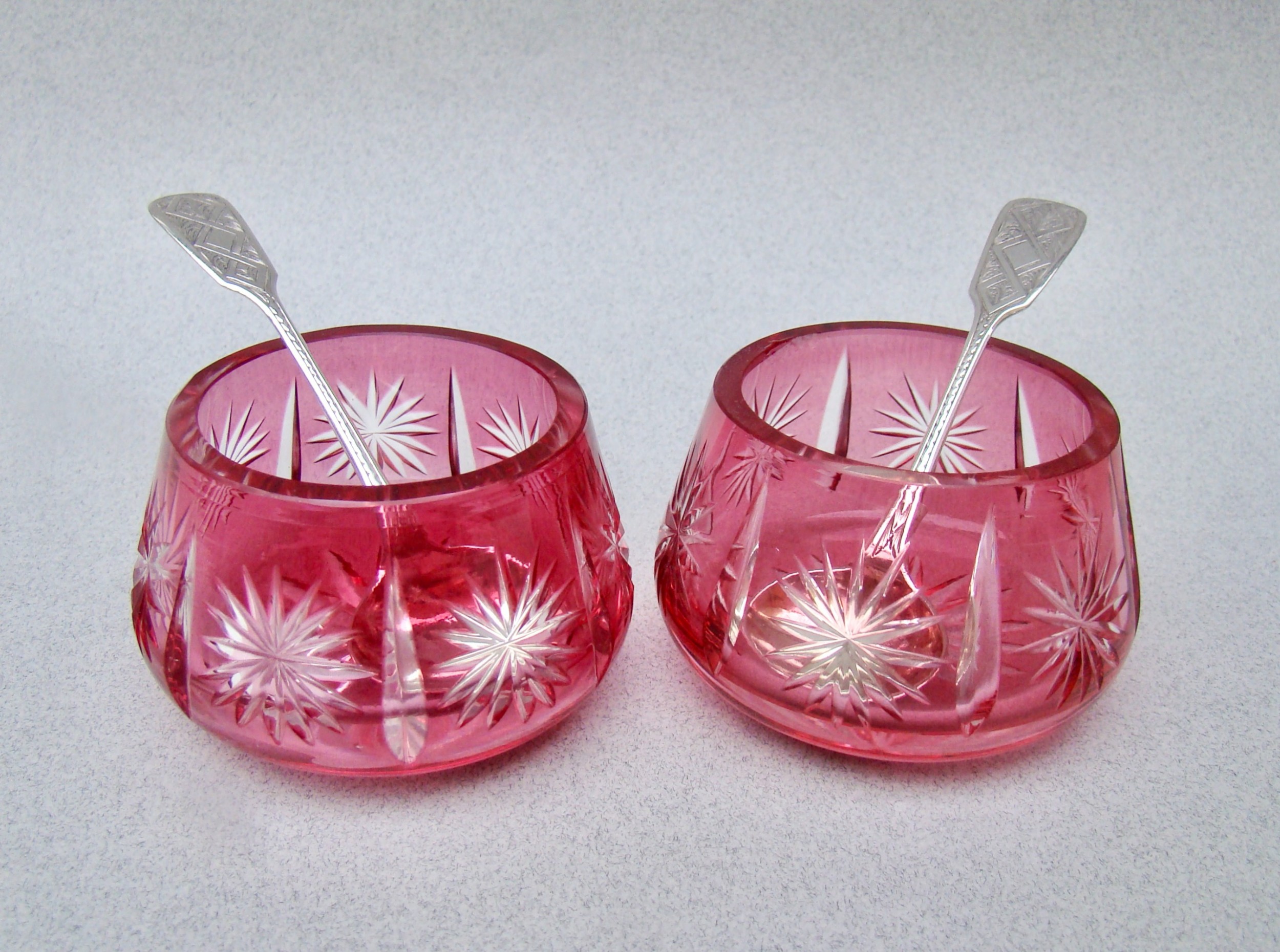 PAIR OF VICTORIAN BOHEMIAN CRANBERRY GLASS SALTS WITH RARE SILVER SPOONS BY THOMAS HART STONE, EXETER 1863