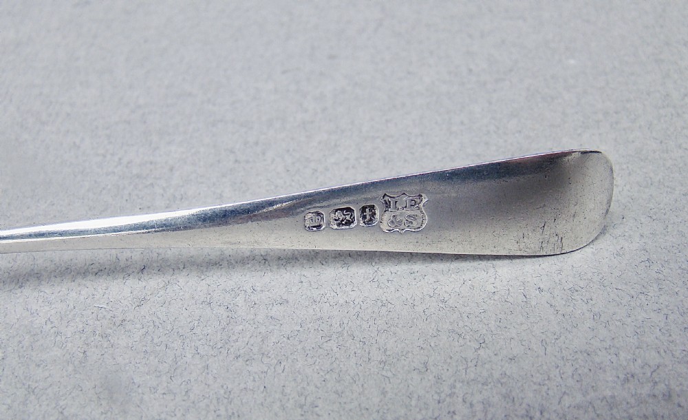 An Edwardian sterling silver shell-shaped butter dish with matching knife presented inside a fitted blue velvet and silk-lined case. View VI
