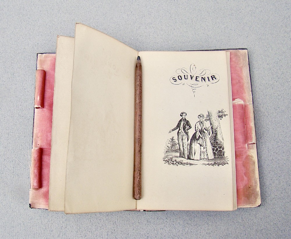 A rectangular 19th-century French tortoiseshell aide-memoire featuring floral silver inlay corner spandrels and a central engraved silver cartouche. View IV