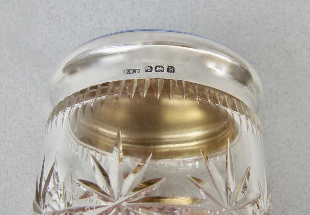 Art Deco cut glass dressing table jar featuring a bright blue guilloche enamel lid with sterling silver hallmarks. View V