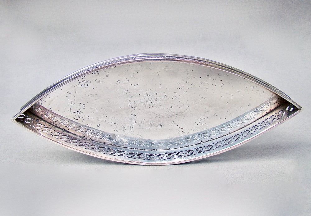 A boat-shaped Georgian Old Sheffield plate snuffer tray featuring a pierced lattice gallery rim. View II