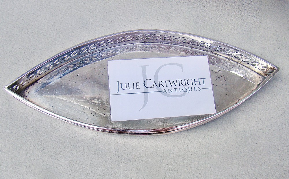 A boat-shaped Georgian Old Sheffield plate snuffer tray featuring a pierced lattice gallery rim. View III