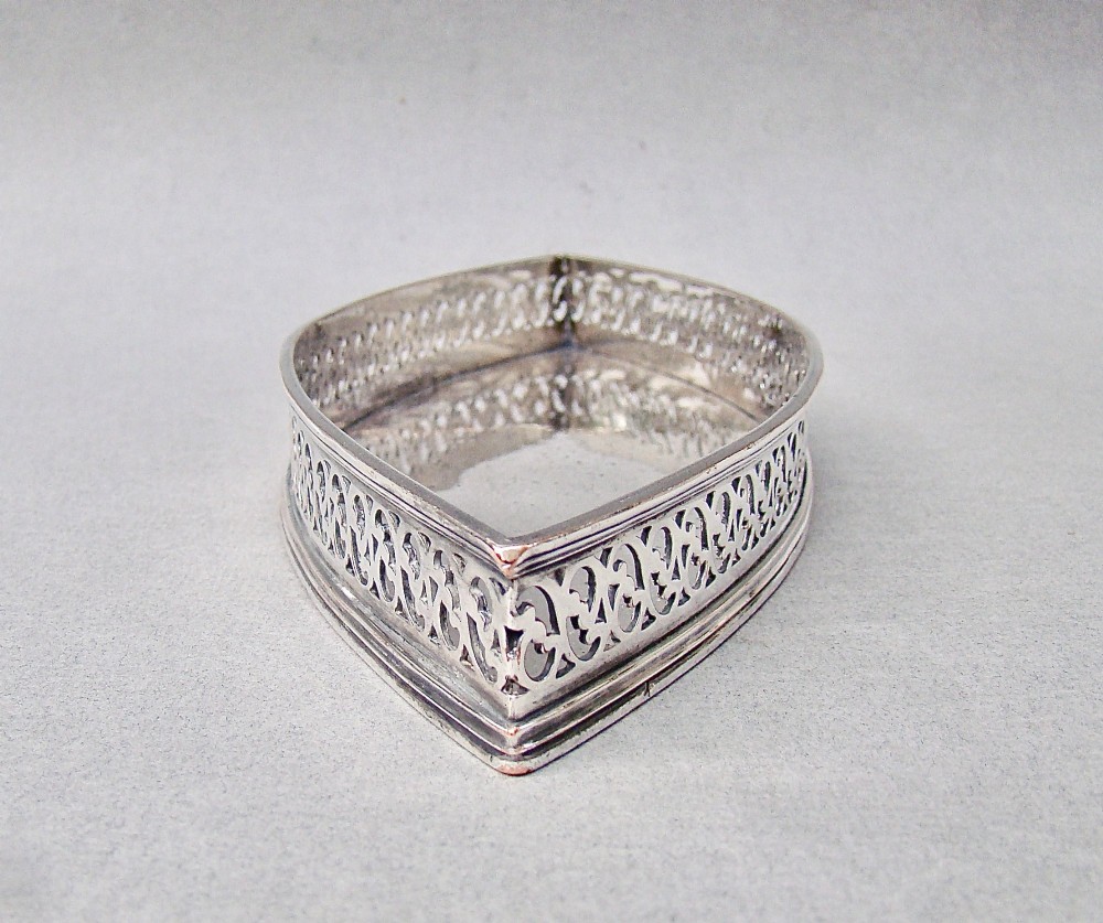 A boat-shaped Georgian Old Sheffield plate snuffer tray featuring a pierced lattice gallery rim. View VI