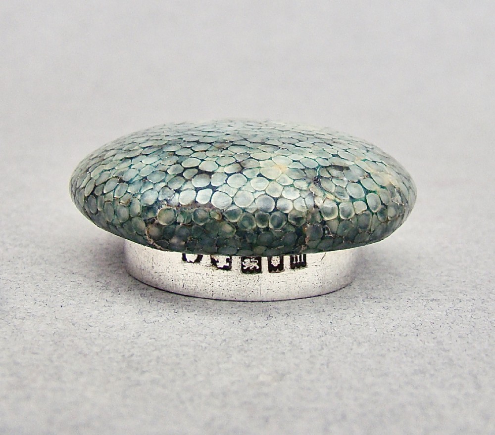 An Art Deco cut glass rouge pot with a hallmarked silver collar and a domed green shagreen lid. View IV