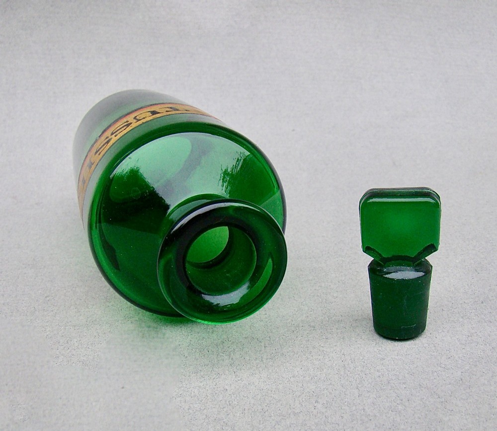 A pair of late Victorian cylindrical Bristol green glass apothecary bottles with ground stoppers and gilt-painted labels. View IV