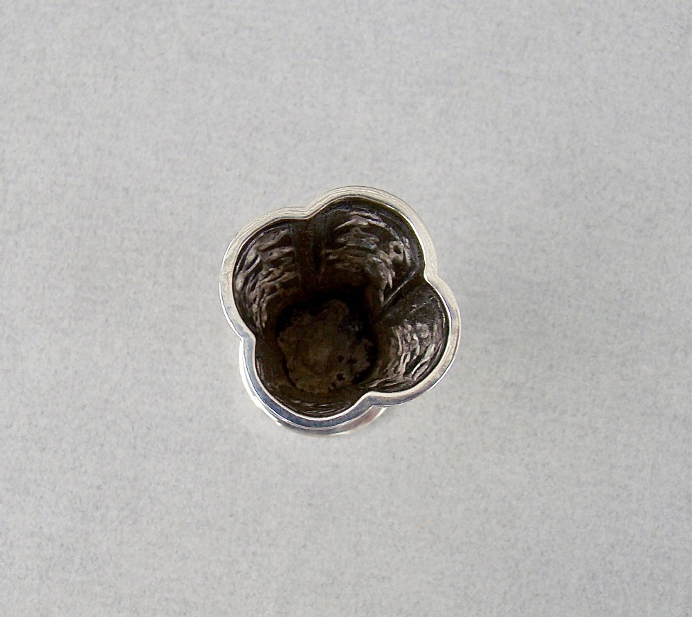 A 19th-century Chinese export silver toothpick holder featuring repousse bamboo motifs on a pedestal base with maker hallmarks stamped on the foot rim. View V