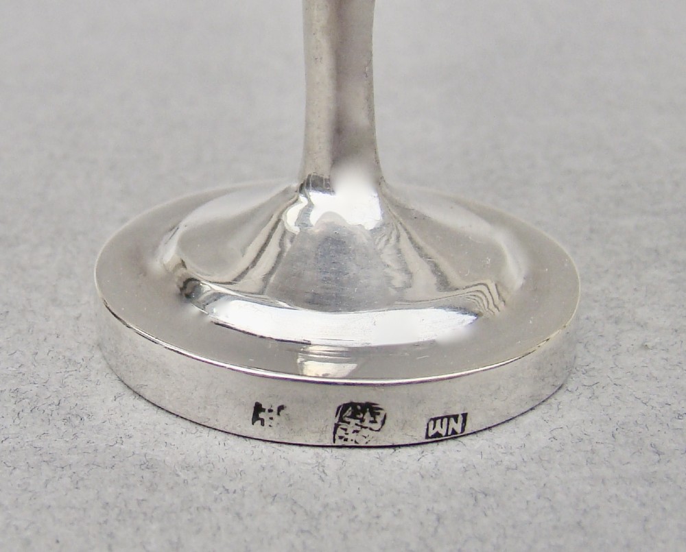 A 19th-century Chinese export silver toothpick holder featuring repousse bamboo motifs on a pedestal base with maker hallmarks stamped on the foot rim. View VI