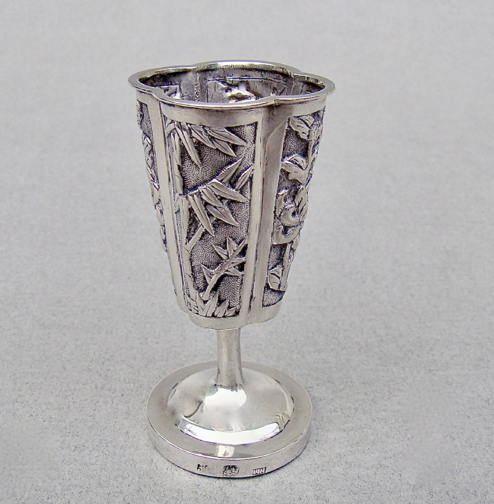 A 19th-century Chinese export silver toothpick holder featuring repousse bamboo motifs on a pedestal base with maker hallmarks stamped on the foot rim. View VII