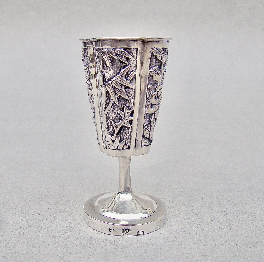 A 19th-century Chinese export silver toothpick holder featuring repousse bamboo motifs on a pedestal base with maker hallmarks stamped on the foot rim. View VIII