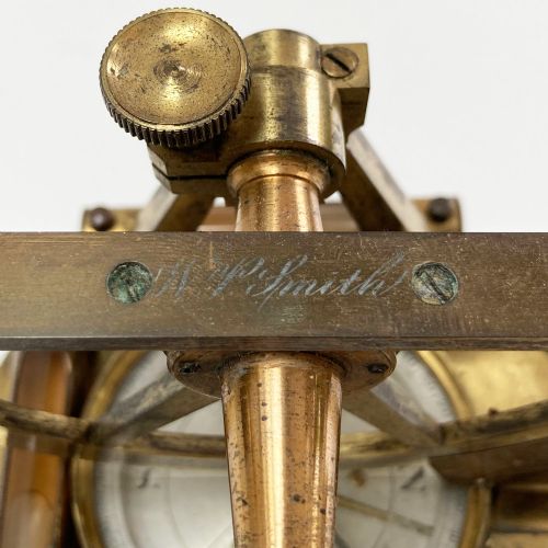 fig 5. A William IV miniature brass altazimuth theodolite featuring a central sighting telescope, vertical semicircular scale, horizontal vernier plate, and levelling screws.