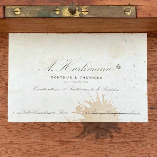 fig 5. An antique French marine navigation set displayed in three open fitted mahogany cases containing a brass sextant, telescopes, and optical filters.