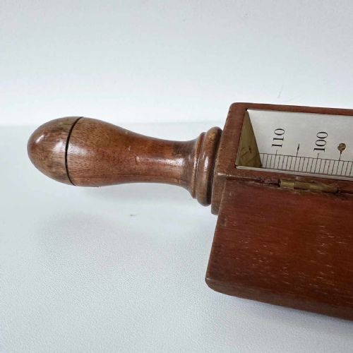 fig 2. A Victorian hotbed soil thermometer featuring a long black pointed iron spike attached to a dark wooden housing with a open hinged protective lid revealing a glass scale.