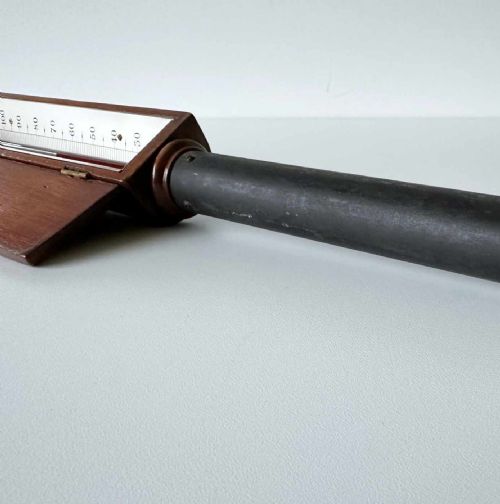 fig 5. A Victorian hotbed soil thermometer featuring a long black pointed iron spike attached to a dark wooden housing with a open hinged protective lid revealing a glass scale.