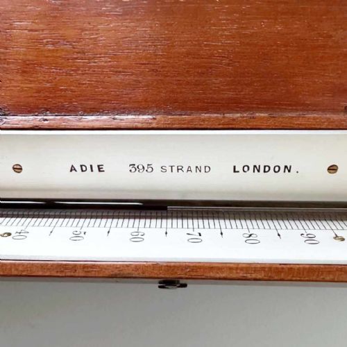 fig 7. A Victorian hotbed soil thermometer featuring a long black pointed iron spike attached to a dark wooden housing with a open hinged protective lid revealing a glass scale.