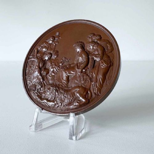 fig 3. A circular Victorian bronze exhibition medallion depicting classical allegorical figures, Britannia, and a reclining lion in high relief.