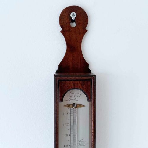fig 4. An 18th-century vertical mahogany cased wall thermometer with an engraved scale plate and glass capillary tube.