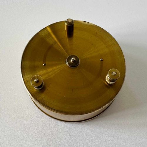 fig 6. A Victorian brass pocket galvanometer with a silvered dial housed inside a open dark leather protective case lined with blue velvet.