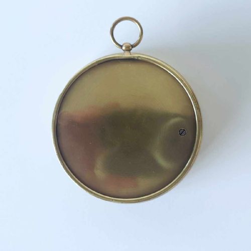 fig 1. A circular brass wall-hanging aneroid barometer featuring a silvered dial with Gothic lettering, calibrated scale, and multiple indicator pointers.
