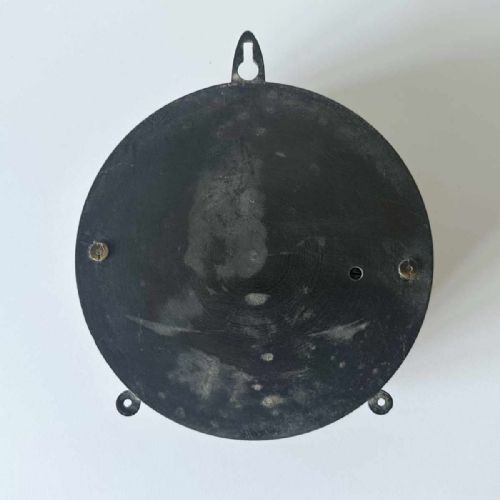 fig 4. A circular Victorian brass aneroid barometer featuring a white enamel dial with black atmospheric pressure readings and blued steel hands.