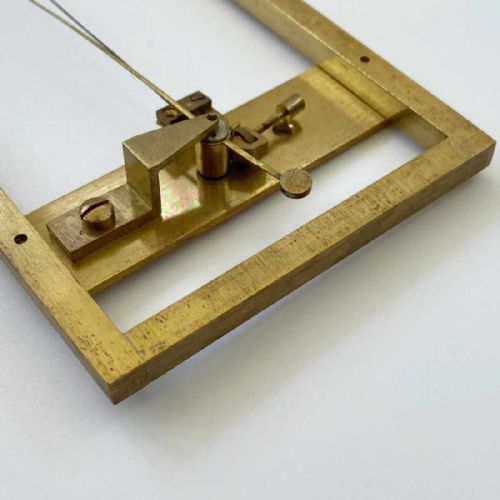 fig 8. A rectangular brass-framed Saussure hair hygrometer featuring engraved text plates and a curved graduated scale with a pointer needle.